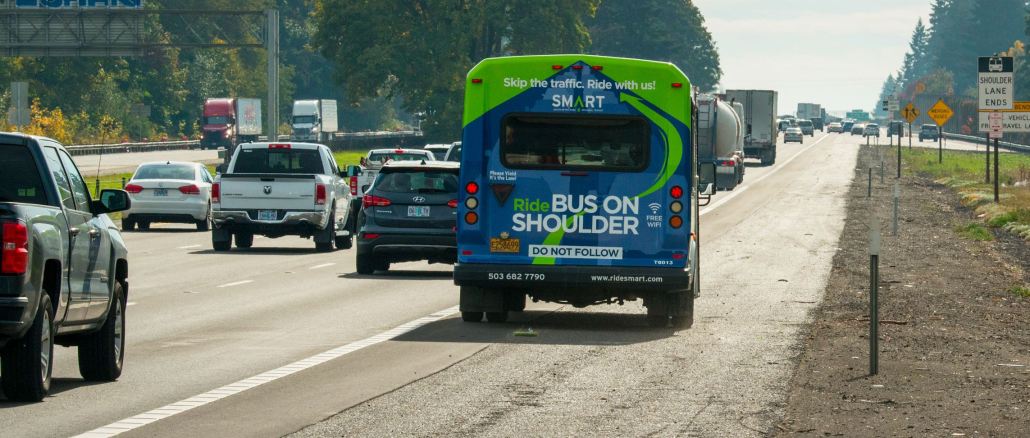 SMART Bus driving on the right shoulder of I-5 during a training exercise between I-205 and Elligsen Road in Wilsonville.